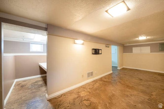 771 E Belmont Ave, Salt Lake City, UT 84105 - below grade area featuring visible vents, baseboards, and a textured ceiling