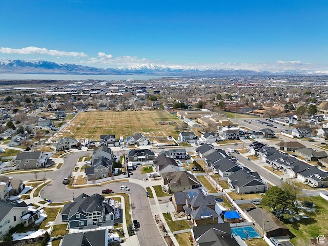 birds eye view of property with a mountain view and a residential view