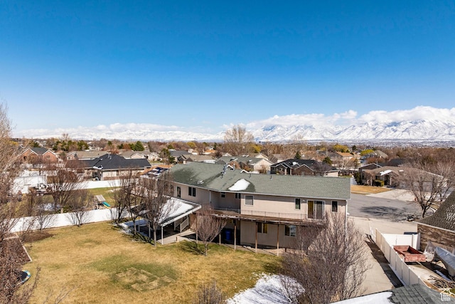 drone / aerial view featuring a mountain view and a residential view