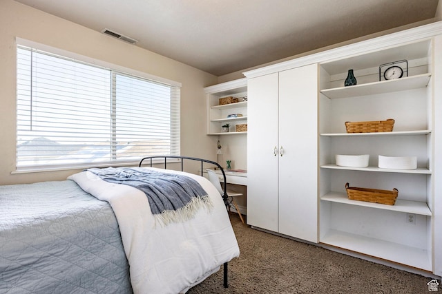 bedroom featuring carpet, visible vents, and a closet