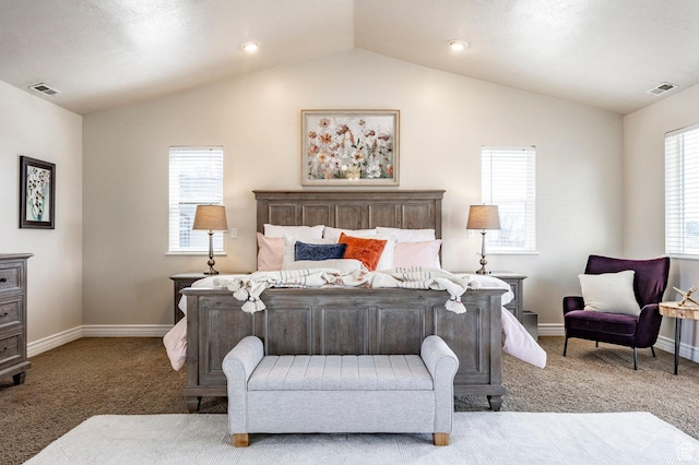 carpeted bedroom with vaulted ceiling, baseboards, and visible vents
