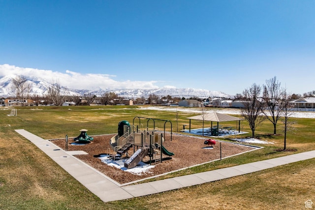 communal playground featuring a gazebo, a mountain view, and a yard