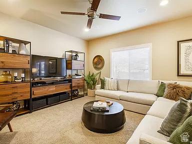 carpeted living area with recessed lighting and ceiling fan