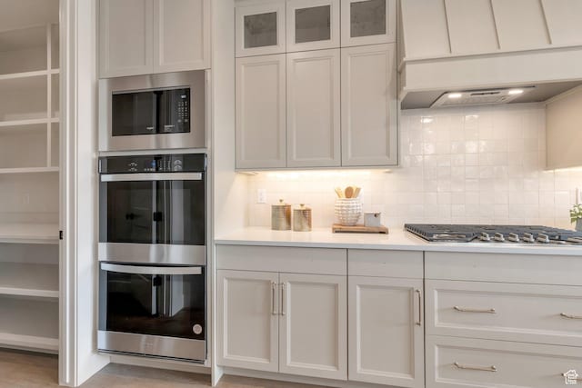 2123 N 520 W, Centerville, UT 84014 - kitchen featuring light countertops, stainless steel appliances, glass insert cabinets, and backsplash