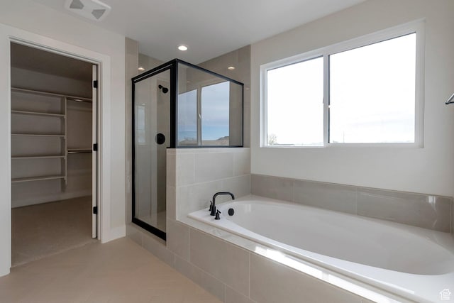 2123 N 520 W, Centerville, UT 84014 - full bathroom featuring visible vents, tile patterned floors, a bath, a spacious closet, and a shower stall