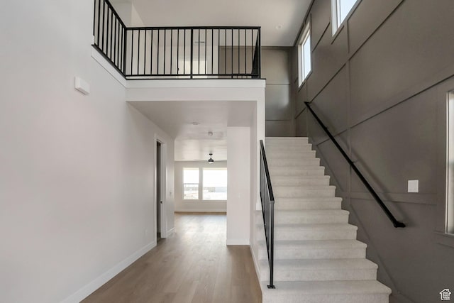 2123 N 520 W, Centerville, UT 84014 - stairway with baseboards, a high ceiling, and wood finished floors