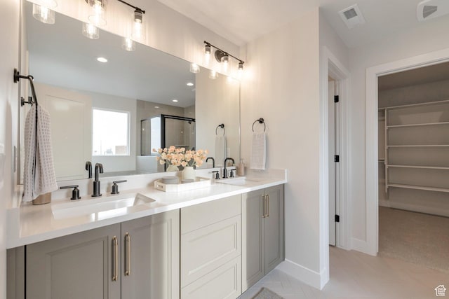 2123 N 520 W, Centerville, UT 84014 - full bath featuring double vanity, visible vents, a shower stall, and a sink