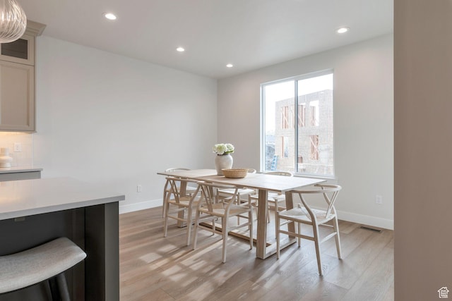 2123 N 520 W, Centerville, UT 84014 - dining area with light wood-style floors, recessed lighting, and baseboards