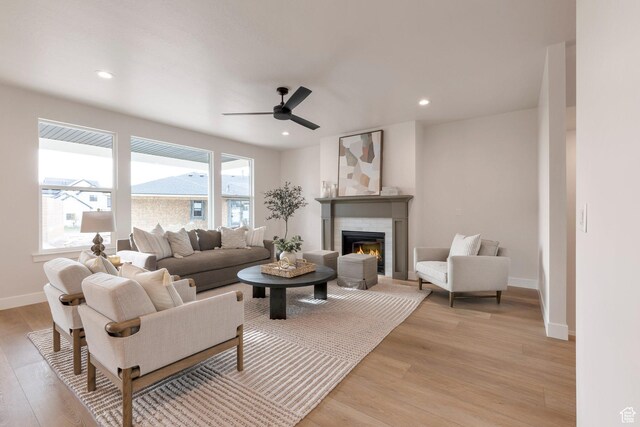 2123 N 520 W, Centerville, UT 84014 - living area with a fireplace, light wood-style floors, a ceiling fan, baseboards, and recessed lighting