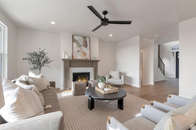 2123 N 520 W, Centerville, UT 84014 - living area with ceiling fan, a glass covered fireplace, recessed lighting, light wood-type flooring, and stairway