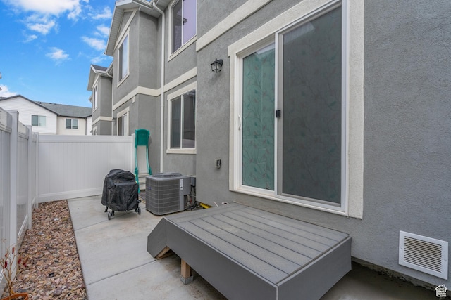 1027 E Reef Dr, Saratoga Springs, UT 84045 - view of patio / terrace with visible vents, central AC unit, and fence