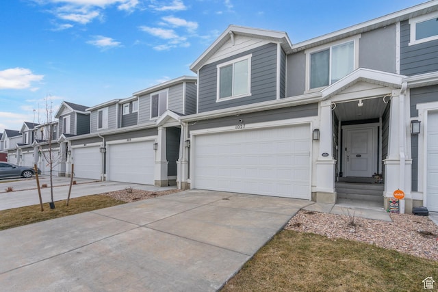 1027 E Reef Dr, Saratoga Springs, UT 84045 - view of property with a residential view, an attached garage, and driveway