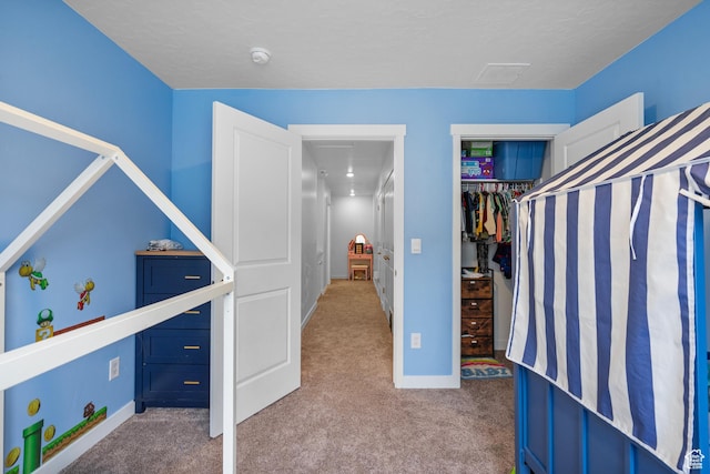 1027 E Reef Dr, Saratoga Springs, UT 84045 - unfurnished bedroom featuring a closet, baseboards, and carpet