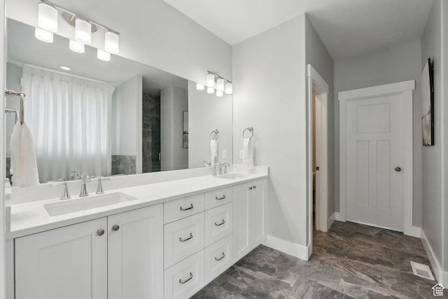 9227 N Horizon Dr, Eagle Mountain, UT 84005 - full bathroom featuring double vanity, visible vents, baseboards, and a sink