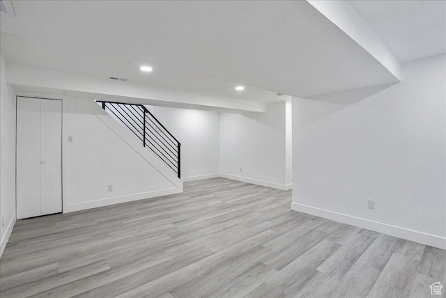 7046 S 2955 E, Cottonwood Heights, UT 84121 - finished basement featuring light wood-style flooring, stairway, recessed lighting, and baseboards