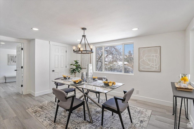 7046 S 2955 E, Cottonwood Heights, UT 84121 - dining room with a chandelier, light wood-style flooring, baseboards, and a textured ceiling