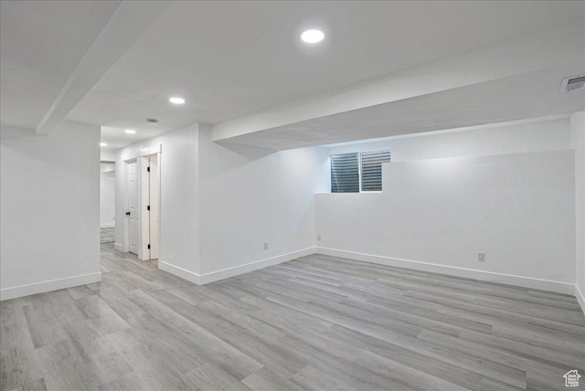 7046 S 2955 E, Cottonwood Heights, UT 84121 - finished below grade area featuring visible vents, baseboards, recessed lighting, and light wood-style floors