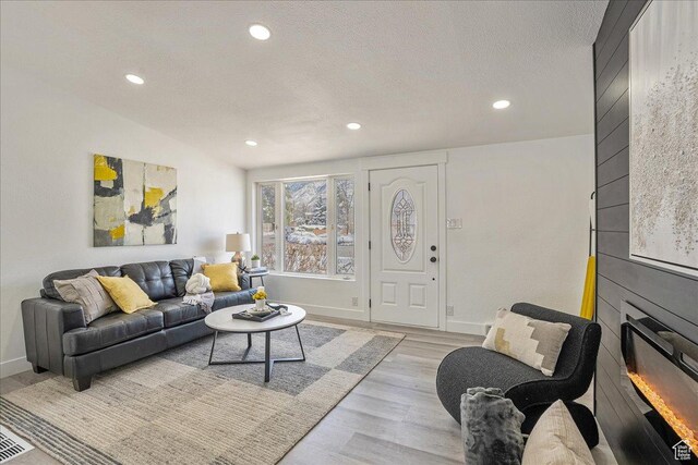 7046 S 2955 E, Cottonwood Heights, UT 84121 - living area featuring recessed lighting, light wood-style floors, a textured ceiling, and baseboards