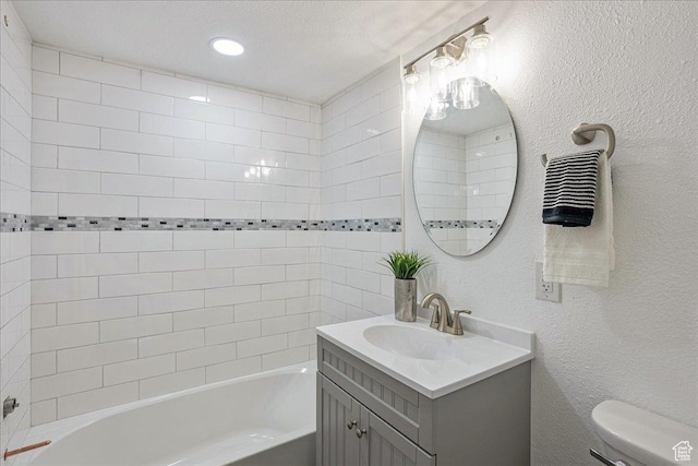 7046 S 2955 E, Cottonwood Heights, UT 84121 - full bath featuring washtub / shower combination, vanity, a textured wall, a textured ceiling, and toilet