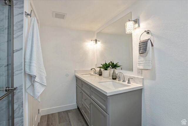 7046 S 2955 E, Cottonwood Heights, UT 84121 - full bath with a shower stall, wood finished floors, and a sink