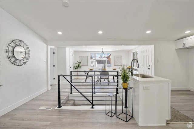 7046 S 2955 E, Cottonwood Heights, UT 84121 - kitchen with light wood-style floors, baseboards, and recessed lighting