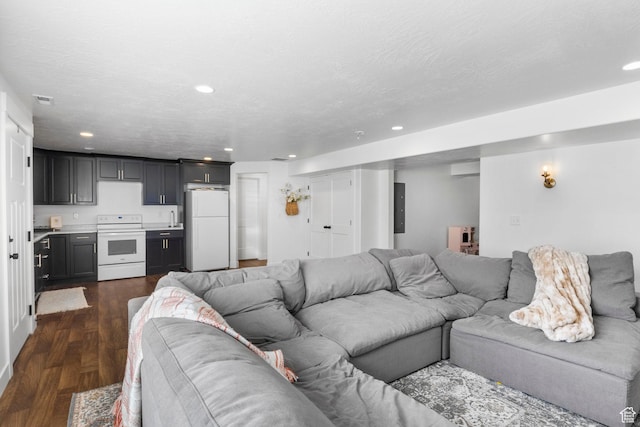 764 E 760 S, Pleasant Grove, UT 84062 - living room featuring visible vents, recessed lighting, dark wood-style flooring, and a textured ceiling