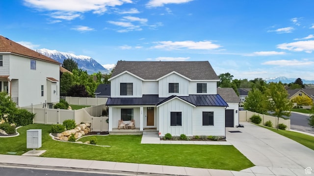 764 E 760 S, Pleasant Grove, UT 84062 - modern inspired farmhouse featuring board and batten siding, concrete driveway, a standing seam roof, a gate, and a mountain view