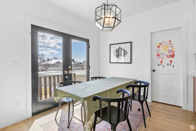 764 E 760 S, Pleasant Grove, UT 84062 - dining area featuring a notable chandelier, french doors, and light wood-type flooring