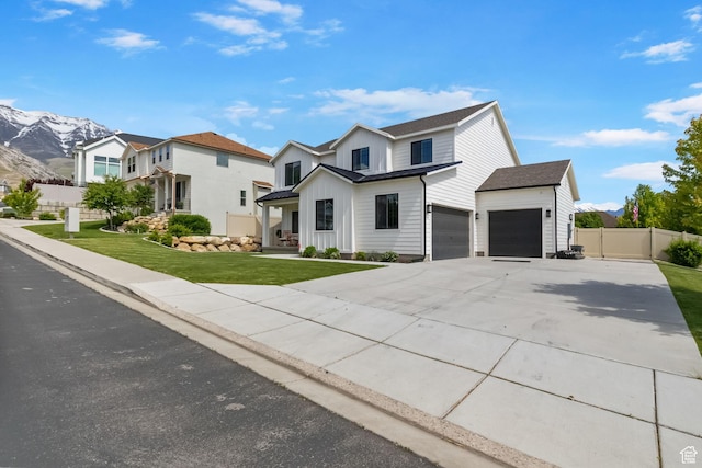 764 E 760 S, Pleasant Grove, UT 84062 - view of front facade with board and batten siding, driveway, a mountain view, and a garage