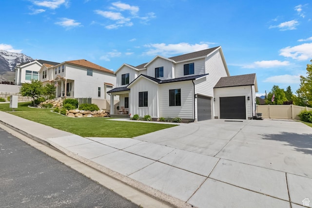 764 E 760 S, Pleasant Grove, UT 84062 - view of front facade featuring board and batten siding, driveway, and an attached garage