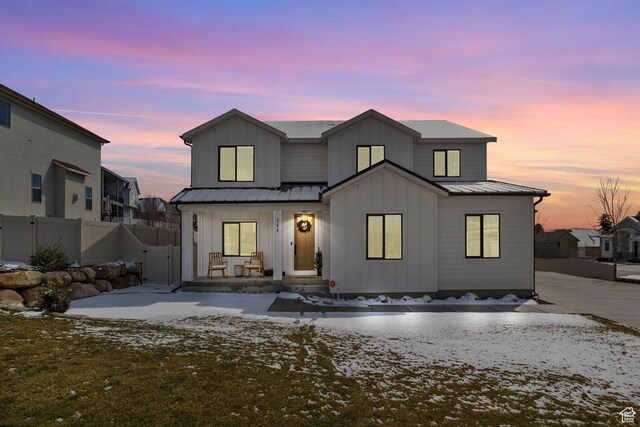 764 E 760 S, Pleasant Grove, UT 84062 - view of front of property featuring a standing seam roof, fence, board and batten siding, covered porch, and metal roof