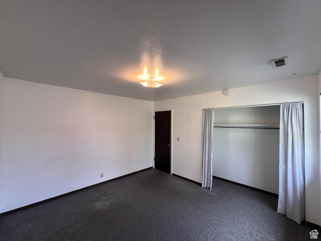 1162 E 400 S, Salt Lake City, UT 84102 - unfurnished bedroom featuring a closet, baseboards, dark carpet, and visible vents