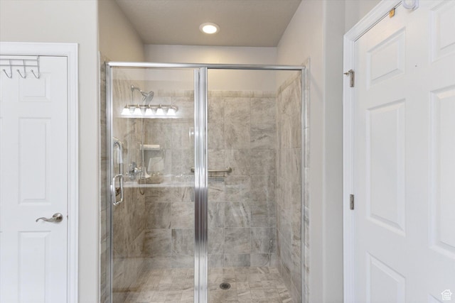 full bathroom with a shower stall and recessed lighting