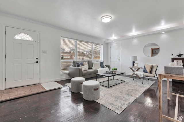 living room featuring crown molding, plenty of natural light, and hardwood / wood-style floors