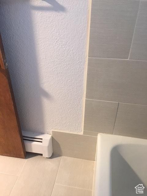301 W 500 N, Logan, UT 84321 - bathroom view of a textured wall and a baseboard radiator