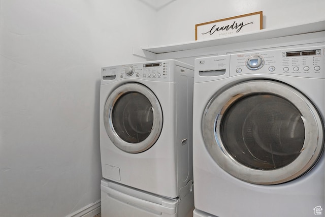 4532 W Cave Run Ln S, South Jordan, UT 84009 - laundry room with washing machine and clothes dryer and baseboards