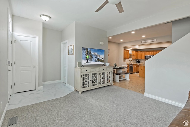 4532 W Cave Run Ln S, South Jordan, UT 84009 - living room featuring a ceiling fan, recessed lighting, baseboards, and light carpet