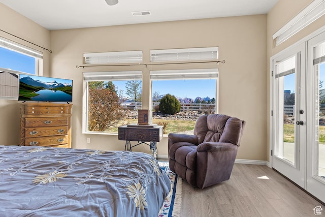 846 S 800 E, New Harmony, UT 84757 - bedroom featuring visible vents, multiple windows, wood finished floors, and access to outside