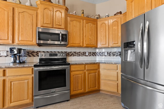 846 S 800 E, New Harmony, UT 84757 - kitchen with light stone counters, stainless steel appliances, and decorative backsplash