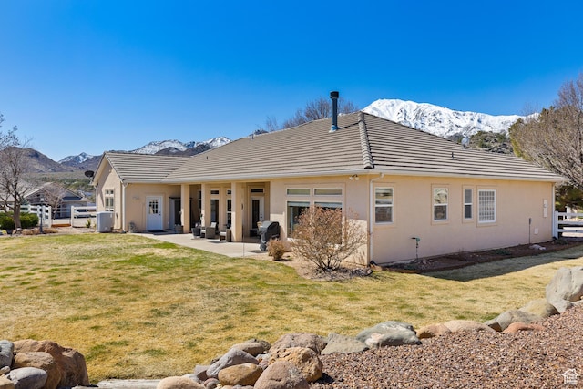 846 S 800 E, New Harmony, UT 84757 - rear view of property with a patio area, a lawn, a mountain view, and a tile roof
