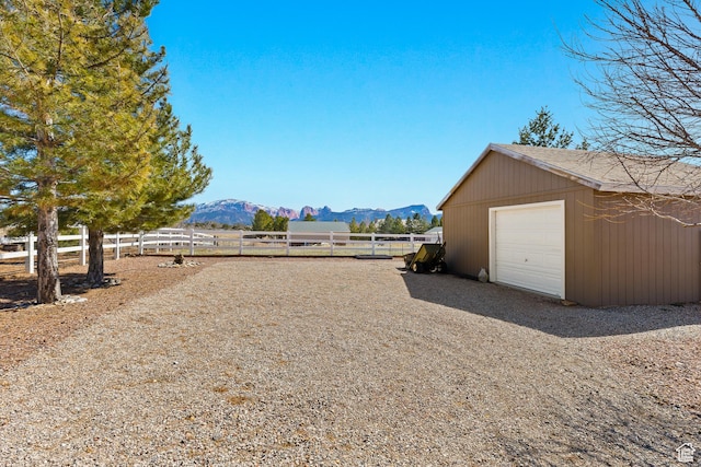846 S 800 E, New Harmony, UT 84757 - view of yard featuring a mountain view, a detached garage, an outdoor structure, and fence