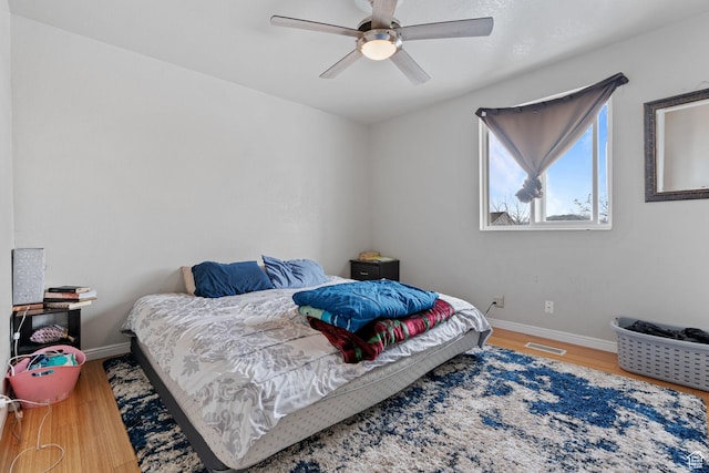 5623 Brandy Wine St, Taylorsville, UT 84118 - bedroom featuring visible vents, a ceiling fan, baseboards, and wood finished floors