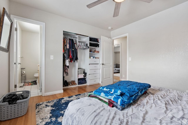 5623 Brandy Wine St, Taylorsville, UT 84118 - bedroom featuring a closet, ensuite bath, wood finished floors, and a ceiling fan