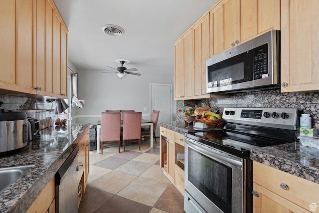 5623 Brandy Wine St, Taylorsville, UT 84118 - kitchen featuring visible vents, dark countertops, appliances with stainless steel finishes, and light brown cabinetry