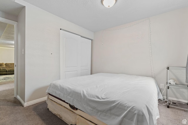 5623 Brandy Wine St, Taylorsville, UT 84118 - bedroom with a closet, baseboards, and carpet floors