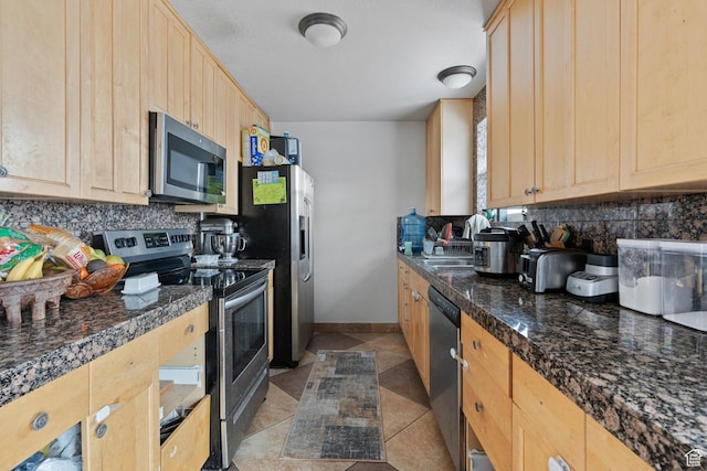 5623 Brandy Wine St, Taylorsville, UT 84118 - kitchen with backsplash, appliances with stainless steel finishes, and light brown cabinetry