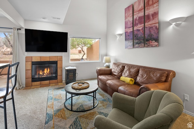3354 E Fairway Loop, Moab, UT 84532 - living room with a wealth of natural light, a fireplace, baseboards, and carpet