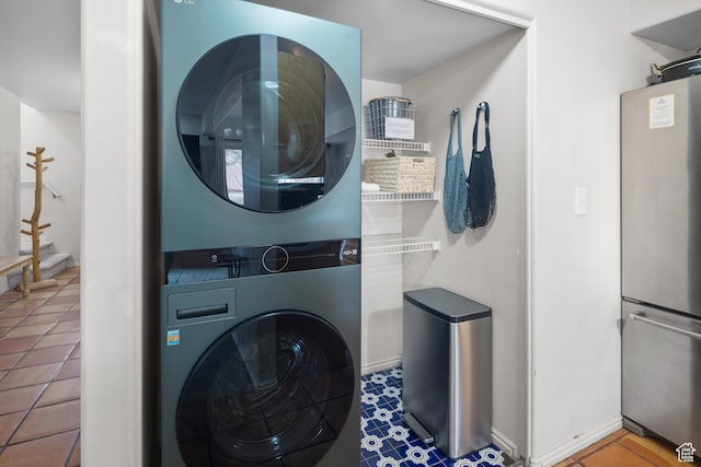 3354 E Fairway Loop, Moab, UT 84532 - clothes washing area with tile patterned floors, laundry area, and stacked washer / drying machine