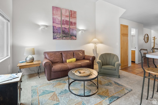 3354 E Fairway Loop, Moab, UT 84532 - carpeted living area featuring tile patterned floors and baseboards