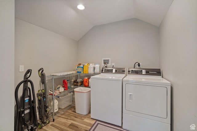 2558 Mountain Glen Rd, Erda, UT 84074 - laundry room with washer and clothes dryer and light wood-style flooring